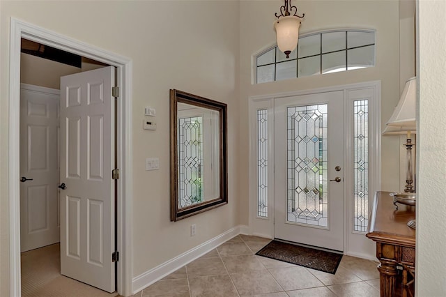 tiled entryway with a healthy amount of sunlight