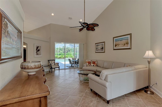 tiled living room featuring high vaulted ceiling and ceiling fan