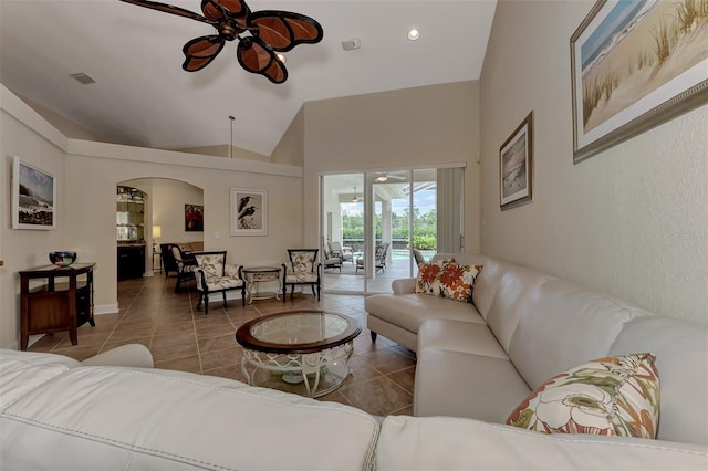 tiled living room with vaulted ceiling and ceiling fan