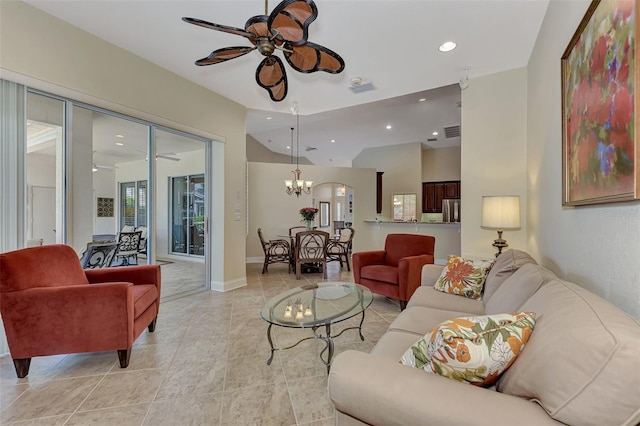 living room with ceiling fan with notable chandelier