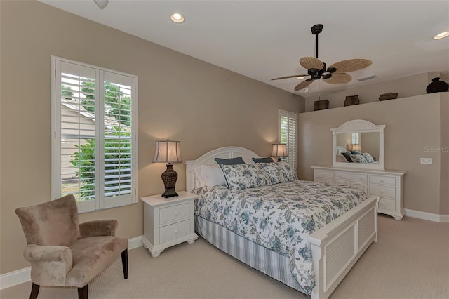 bedroom featuring light carpet and ceiling fan