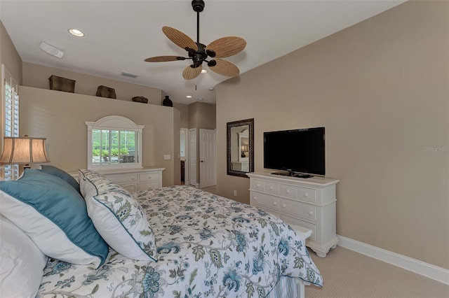 bedroom with light carpet and ceiling fan