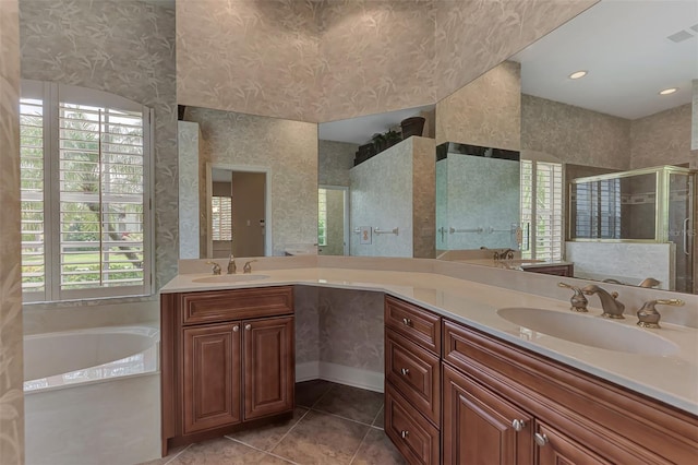 bathroom with vanity, tile patterned flooring, and independent shower and bath