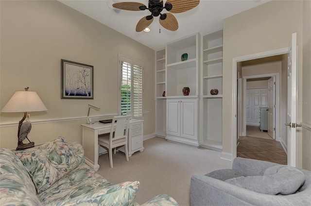 office space featuring light colored carpet and ceiling fan