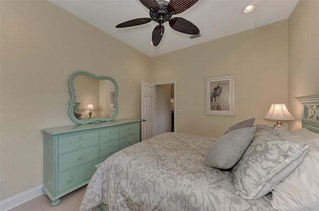 bedroom with ceiling fan and light colored carpet