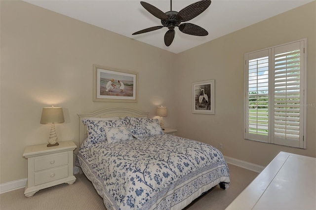 bedroom with ceiling fan and light carpet