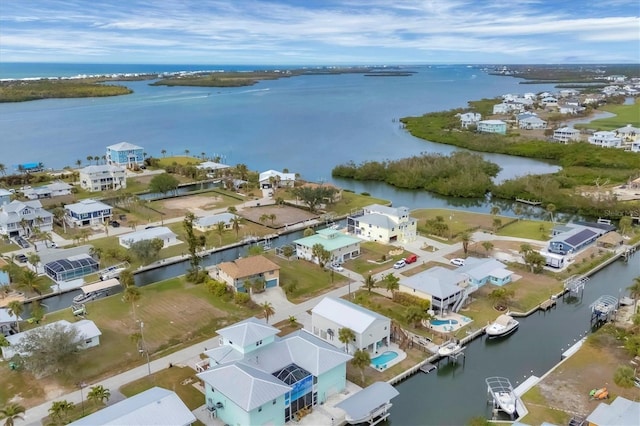 bird's eye view with a water view