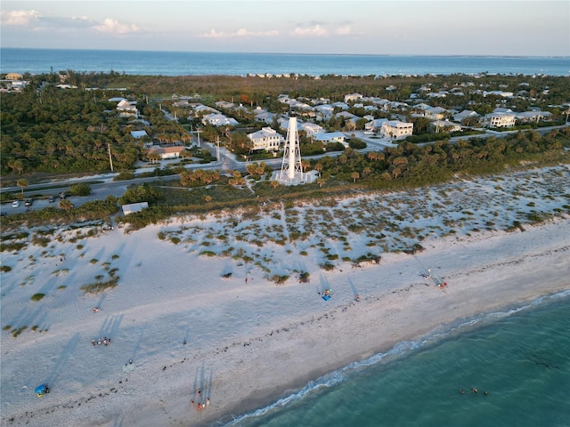 bird's eye view featuring a water view and a view of the beach