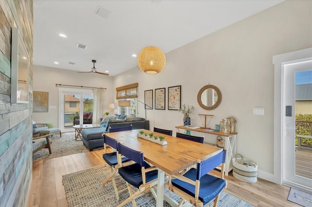 dining space featuring ceiling fan and light wood-type flooring