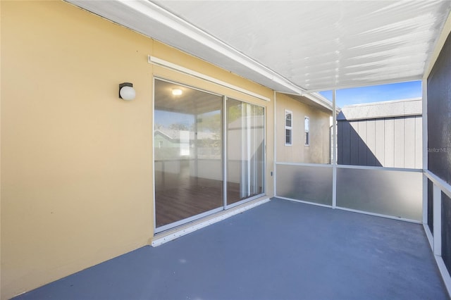 unfurnished sunroom featuring a healthy amount of sunlight