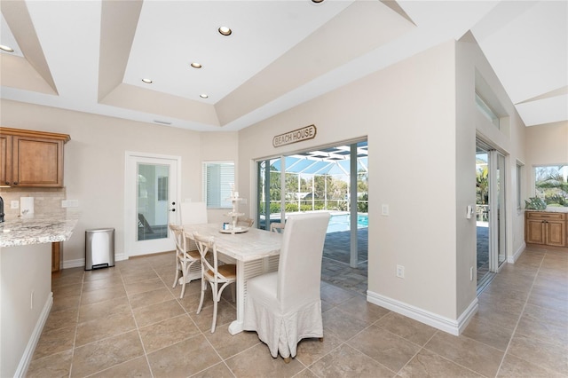 dining room with a tray ceiling