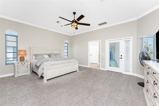 bedroom with multiple windows, ceiling fan, and light carpet