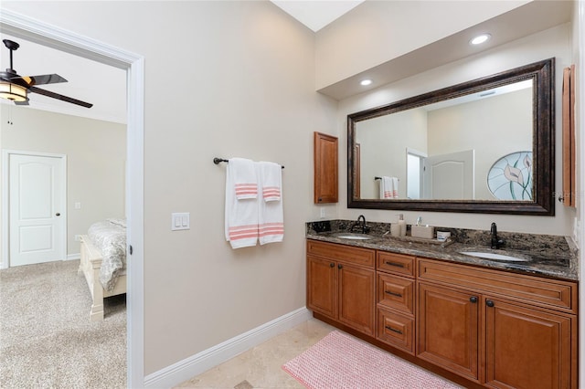 bathroom featuring vanity, crown molding, and ceiling fan