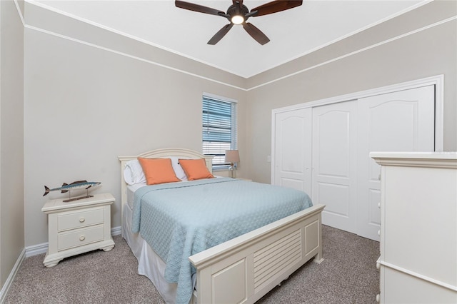 bedroom with carpet flooring, ceiling fan, and a closet