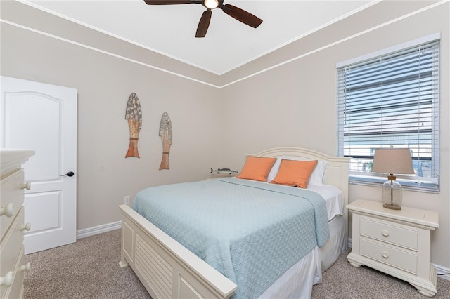 bedroom featuring light carpet and ceiling fan