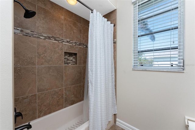 bathroom with shower / bath combo