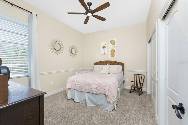 carpeted bedroom featuring ceiling fan