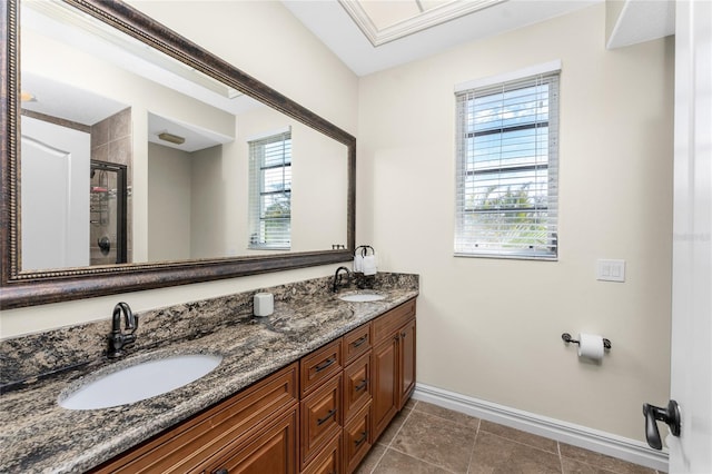 bathroom featuring vanity and a shower with shower door