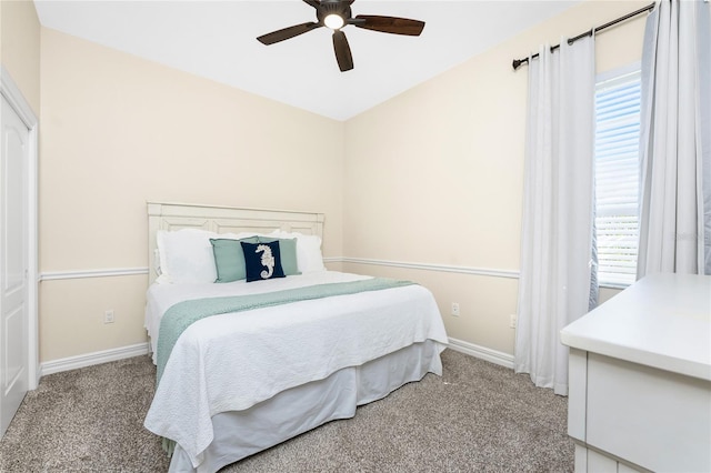 bedroom featuring ceiling fan and carpet