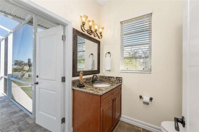 bathroom with vanity and toilet