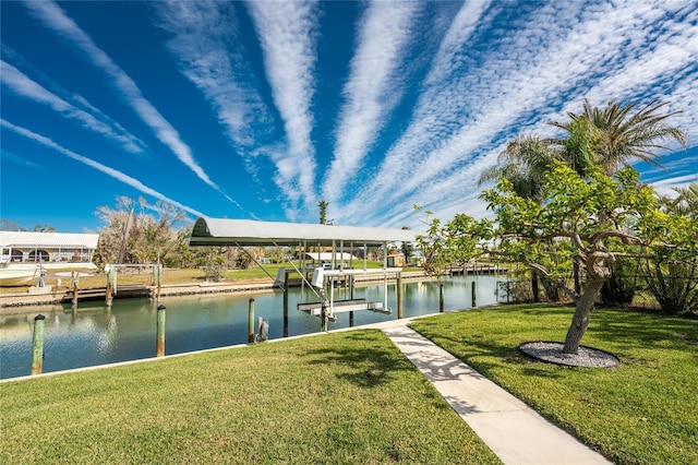 dock area with a water view and a lawn