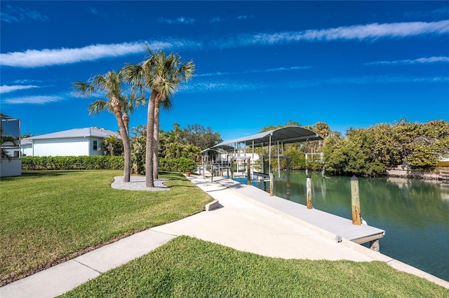 dock area featuring a water view and a yard