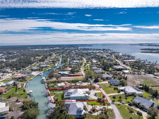 birds eye view of property featuring a water view