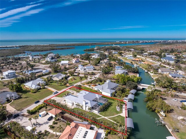 birds eye view of property featuring a water view