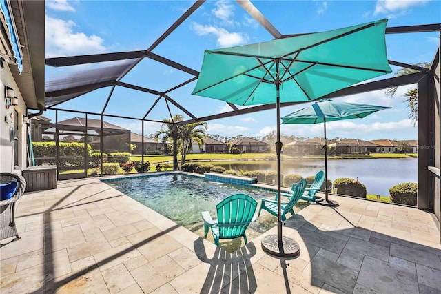 view of swimming pool featuring a water view, pool water feature, a patio, and glass enclosure