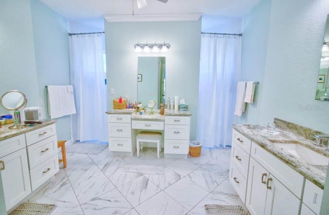 bathroom with vanity and crown molding