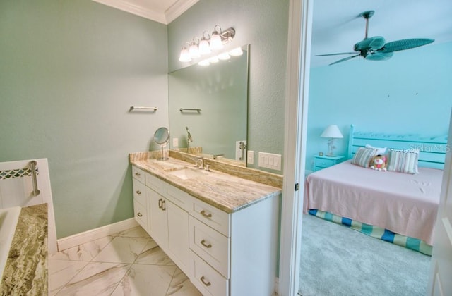 bathroom featuring crown molding, vanity, and ceiling fan