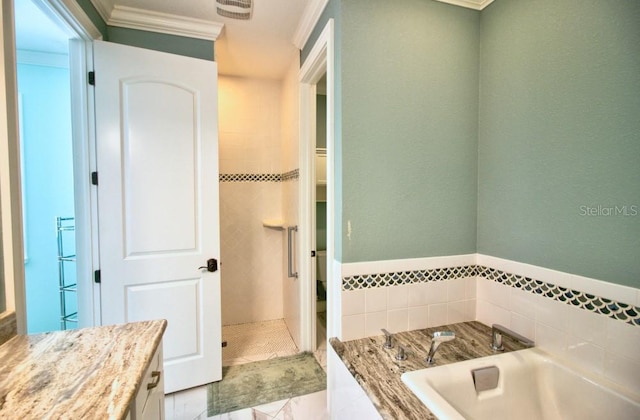 bathroom with crown molding, vanity, and separate shower and tub