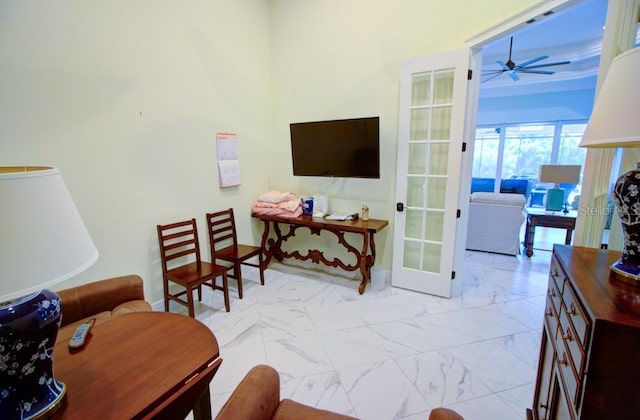 living room with french doors and ceiling fan