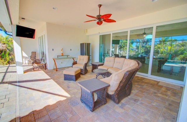 view of patio / terrace with an outdoor living space and ceiling fan