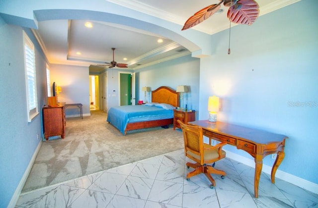 bedroom featuring crown molding, a raised ceiling, and ceiling fan