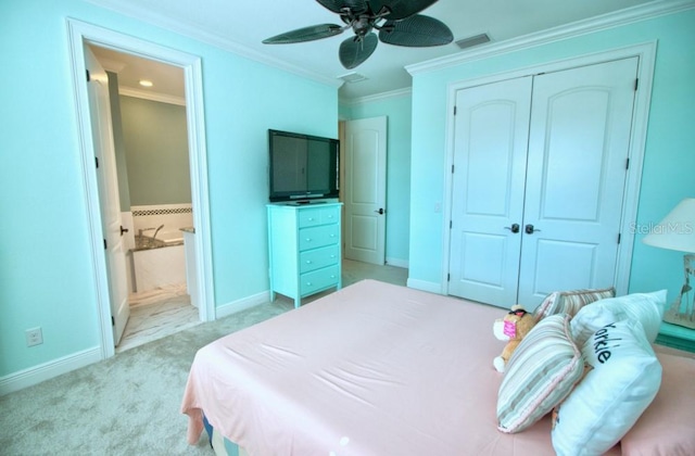 bedroom with ceiling fan, ornamental molding, light colored carpet, and a closet