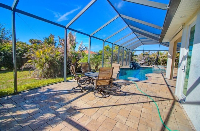 view of pool featuring a lanai and a patio area