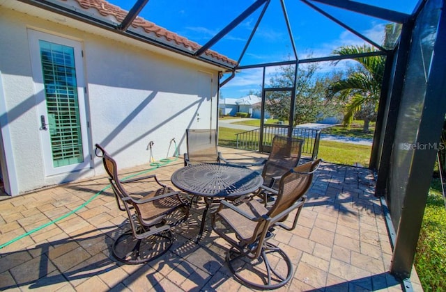 view of patio with a lanai