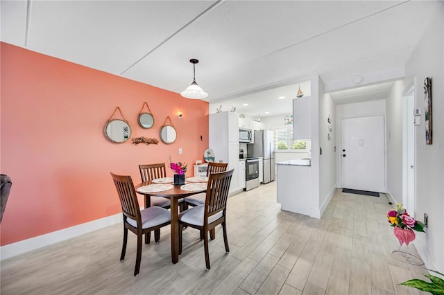 dining room with light hardwood / wood-style flooring