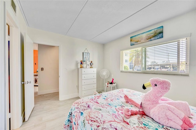 bedroom with light wood-type flooring