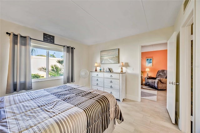 bedroom with light wood-type flooring