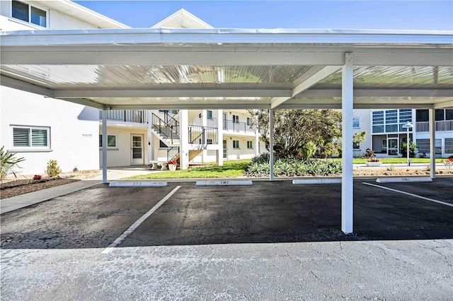 view of vehicle parking with a carport