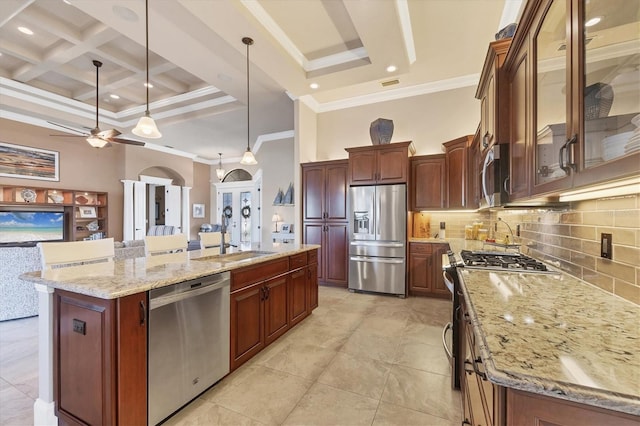 kitchen featuring pendant lighting, appliances with stainless steel finishes, a spacious island, coffered ceiling, and decorative backsplash