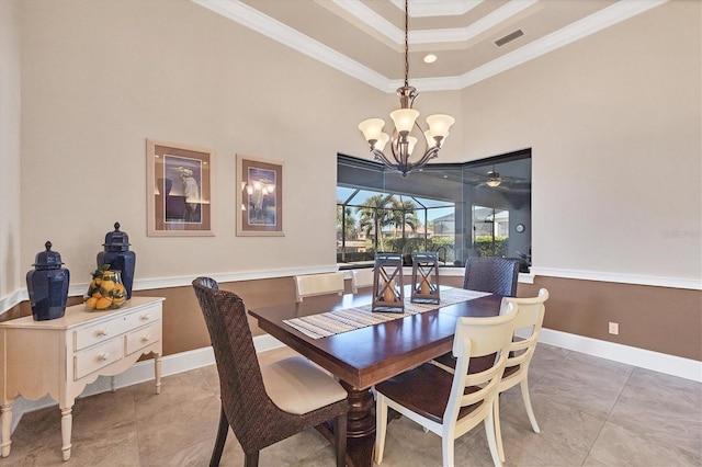 dining room featuring crown molding, a towering ceiling, and tile patterned floors