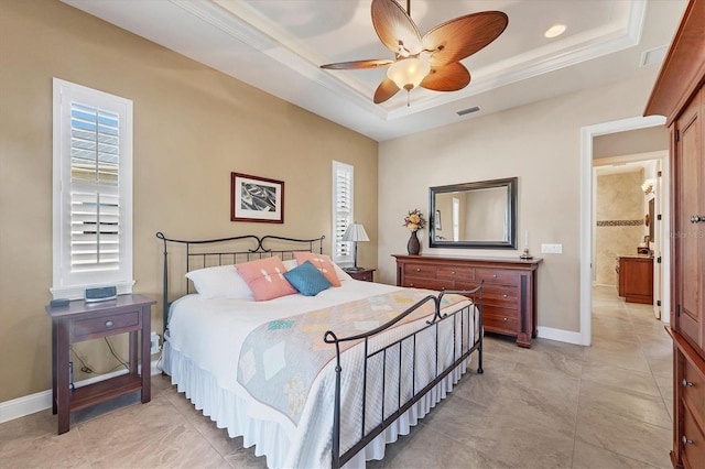 bedroom featuring a raised ceiling, crown molding, and ceiling fan