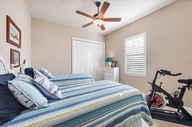 bedroom featuring ceiling fan and a closet