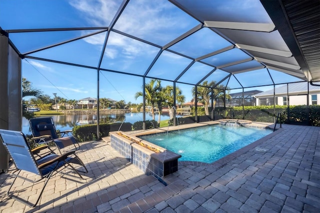 view of pool featuring a patio, a water view, glass enclosure, pool water feature, and an in ground hot tub