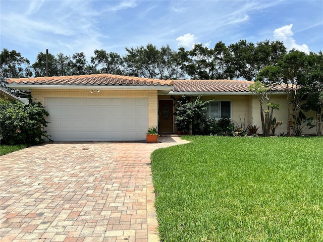 1755 Georgia Ave NE, Saint Petersburg, FL 33703 - single story home with a garage and a front yard