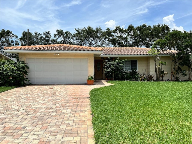 single story home with a garage and a front yard