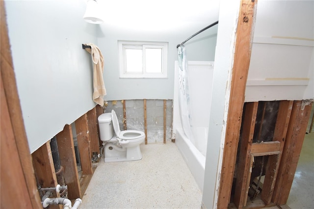 bathroom with shower / bath combo and toilet